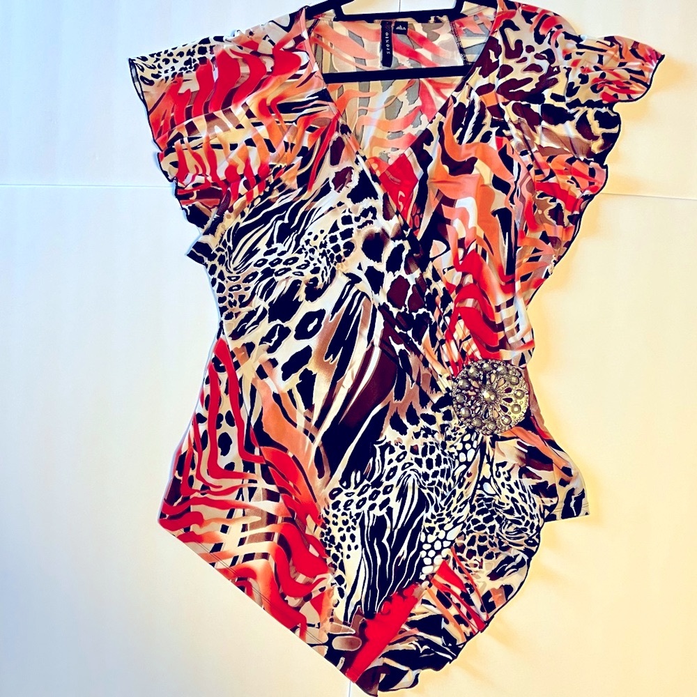 Animal/leopard print blouse with jewel accent. Like new. Sz L
